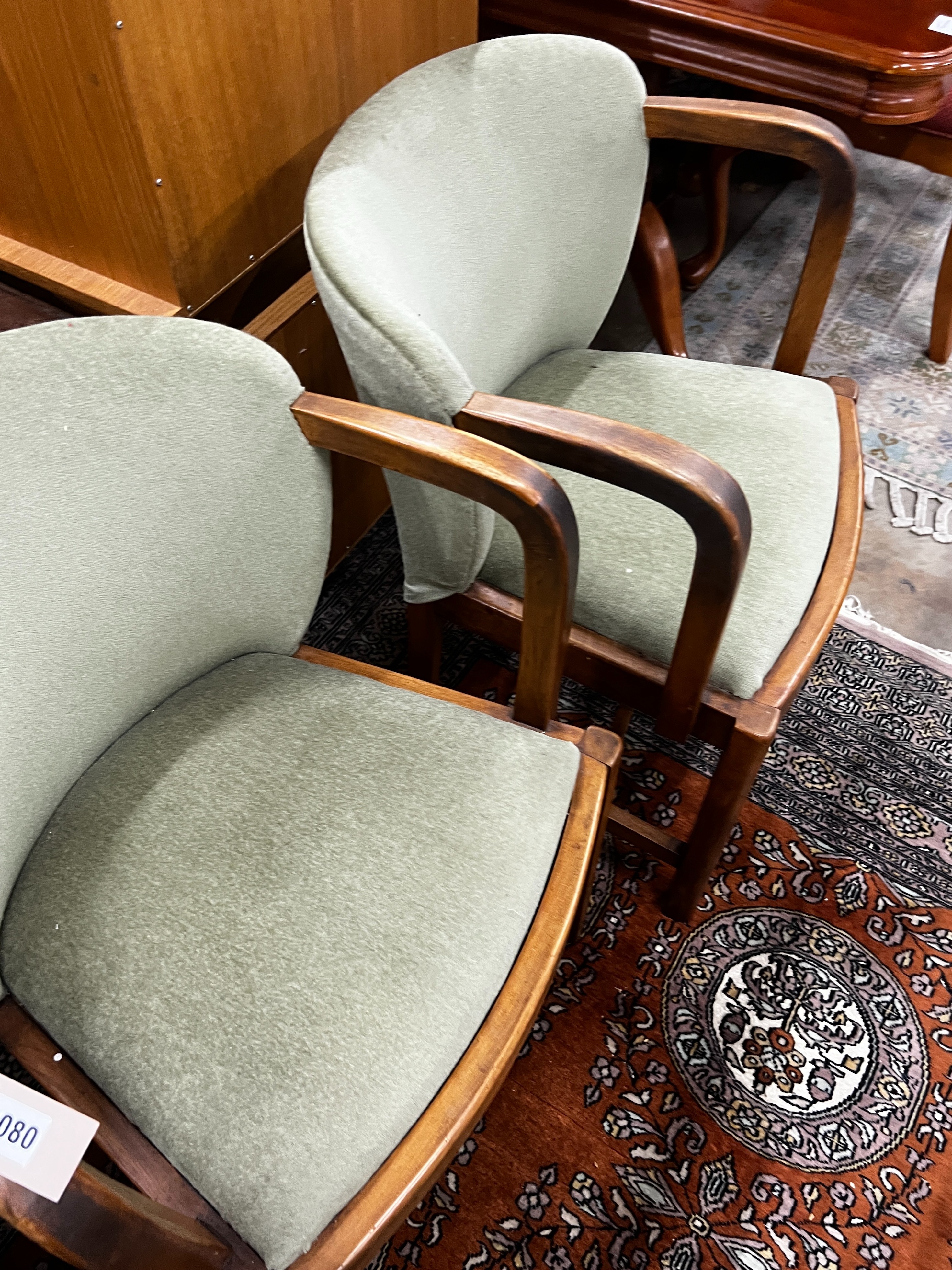 A set of four Art Deco style walnut upholstered tub elbow chairs, width 55cm, depth 54cm, height 78cm